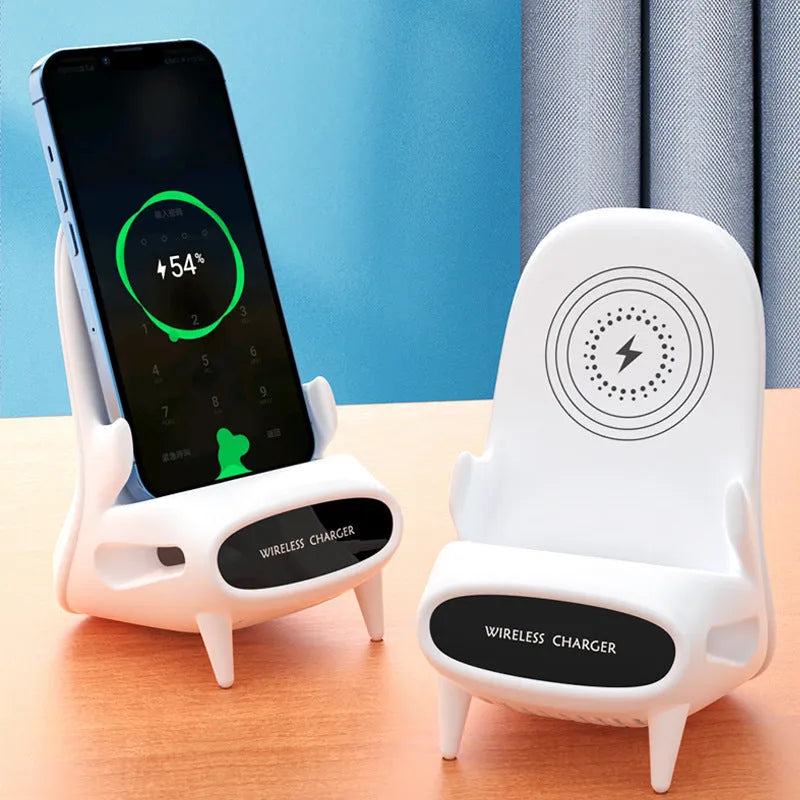 White mini chair-shaped wireless charging stand holding a mobile phone at an angle.