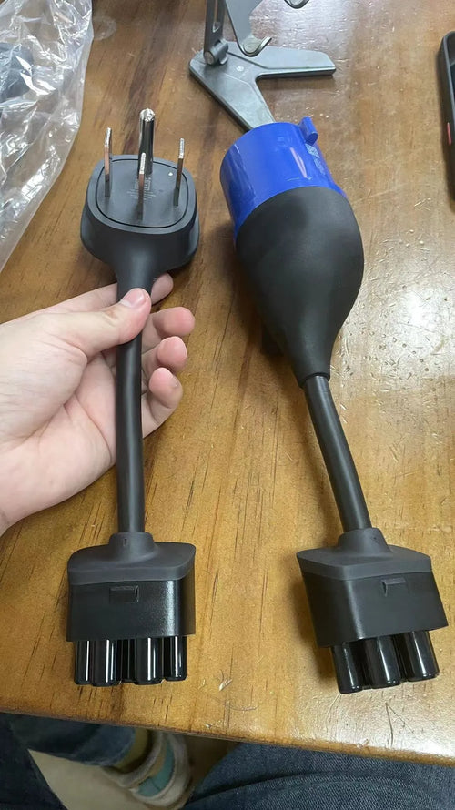 American plug to car charger adapter cable with white sheath on a grey background.