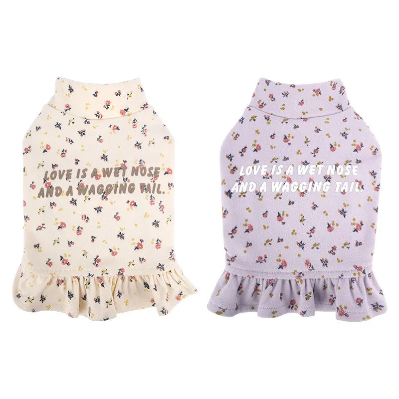 Small dog wearing light purple pet undershirt with floral skirt detail for teddy or bichon breeds