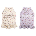 Small dog wearing light purple pet undershirt with floral skirt detail for teddy or bichon breeds