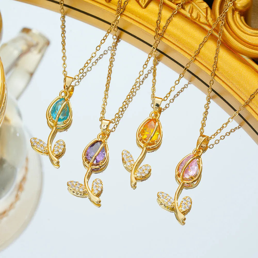 Zircon Tulip necklace with gold floral pendant on an adjustable titanium steel O-ring chain.