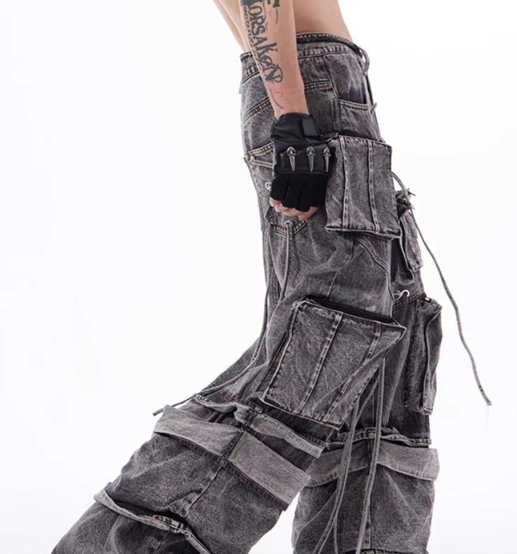 Grey distressed denim mop pants overalls with rope stitching detail on a hanger