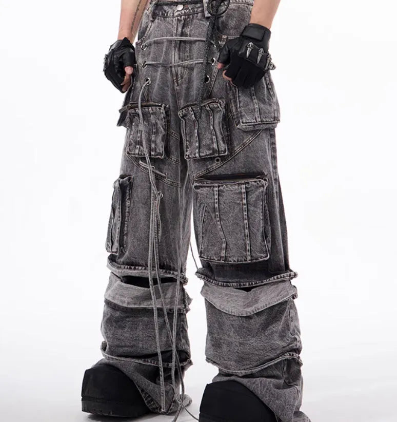 Grey distressed denim mop pants overalls with rope stitching detail on a hanger
