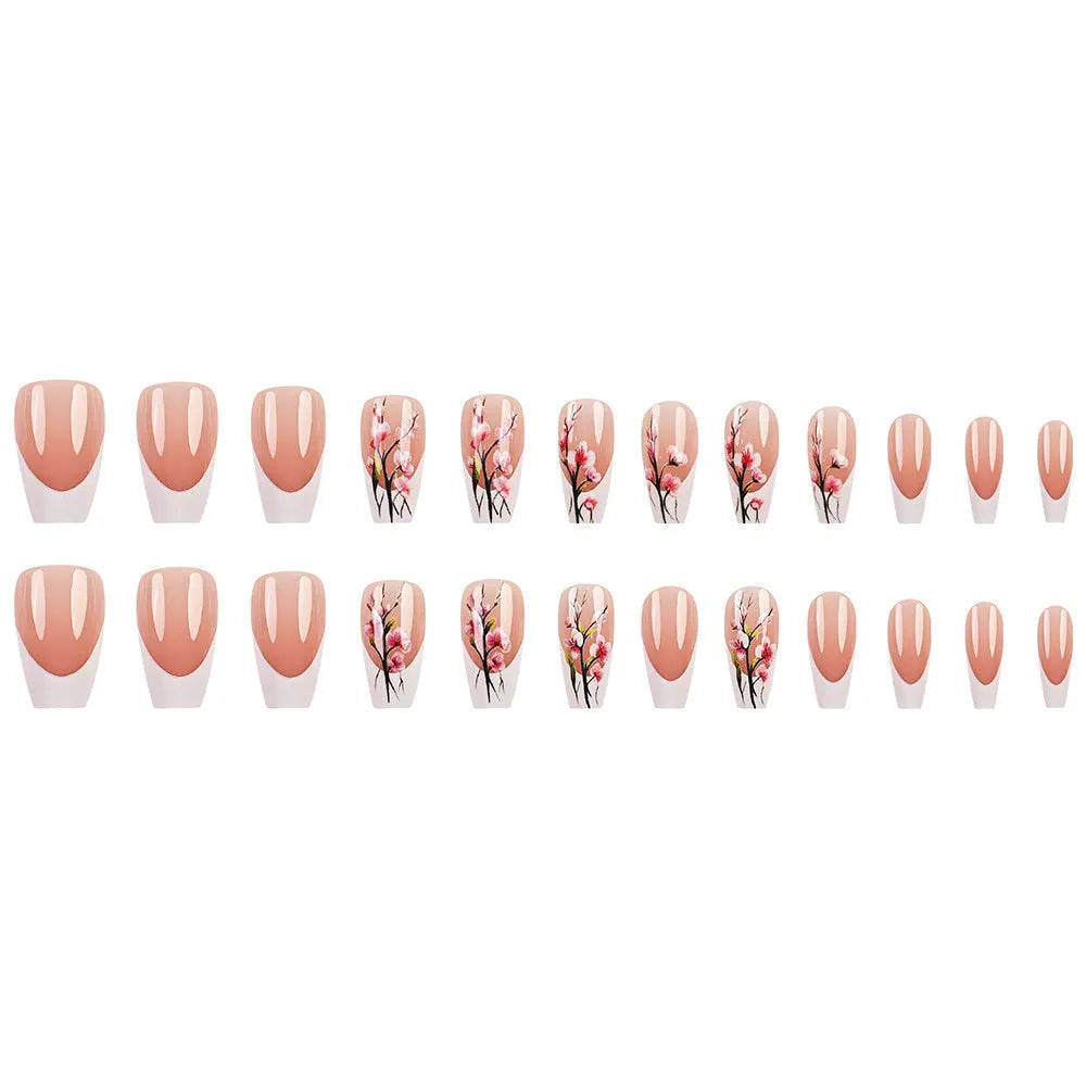 Plum blossom style nail tips with simple white edge French design and starry sky pattern on a table