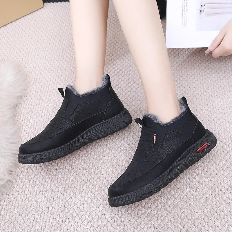 Women's black casual flat ankle boots with a synthetic leather upper and rubber sole.