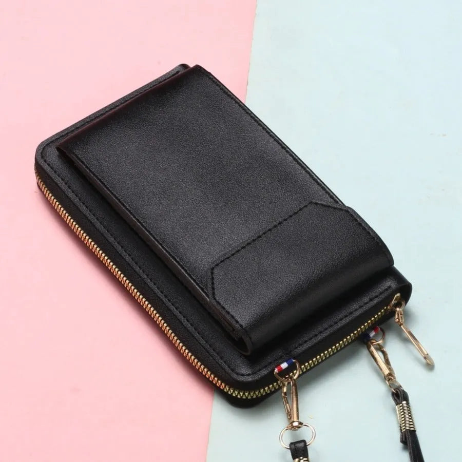 Mini crossbody phone bag for women in black PU leather with adjustable strap and sewing thread detail.