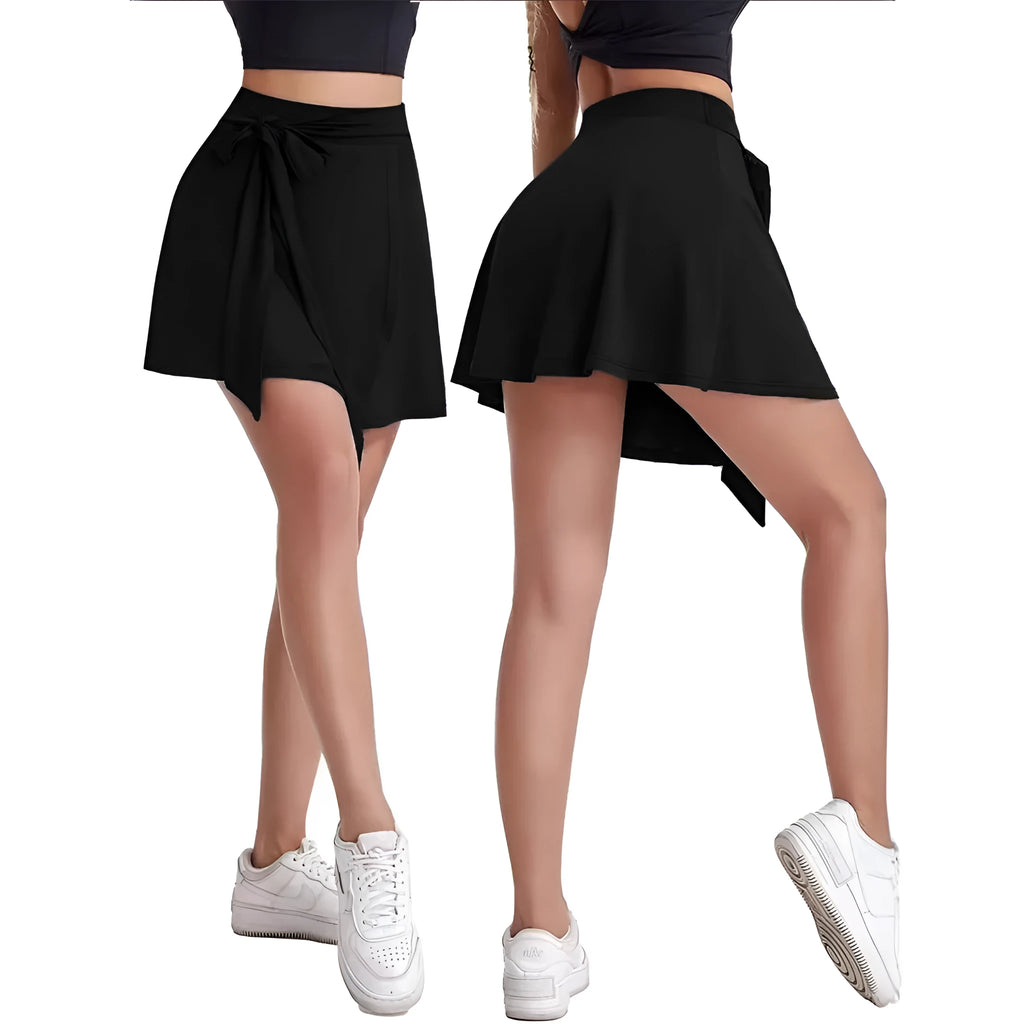 Black thigh-length sports skirt with built-in shorts, high waist, and shoulder strap details.