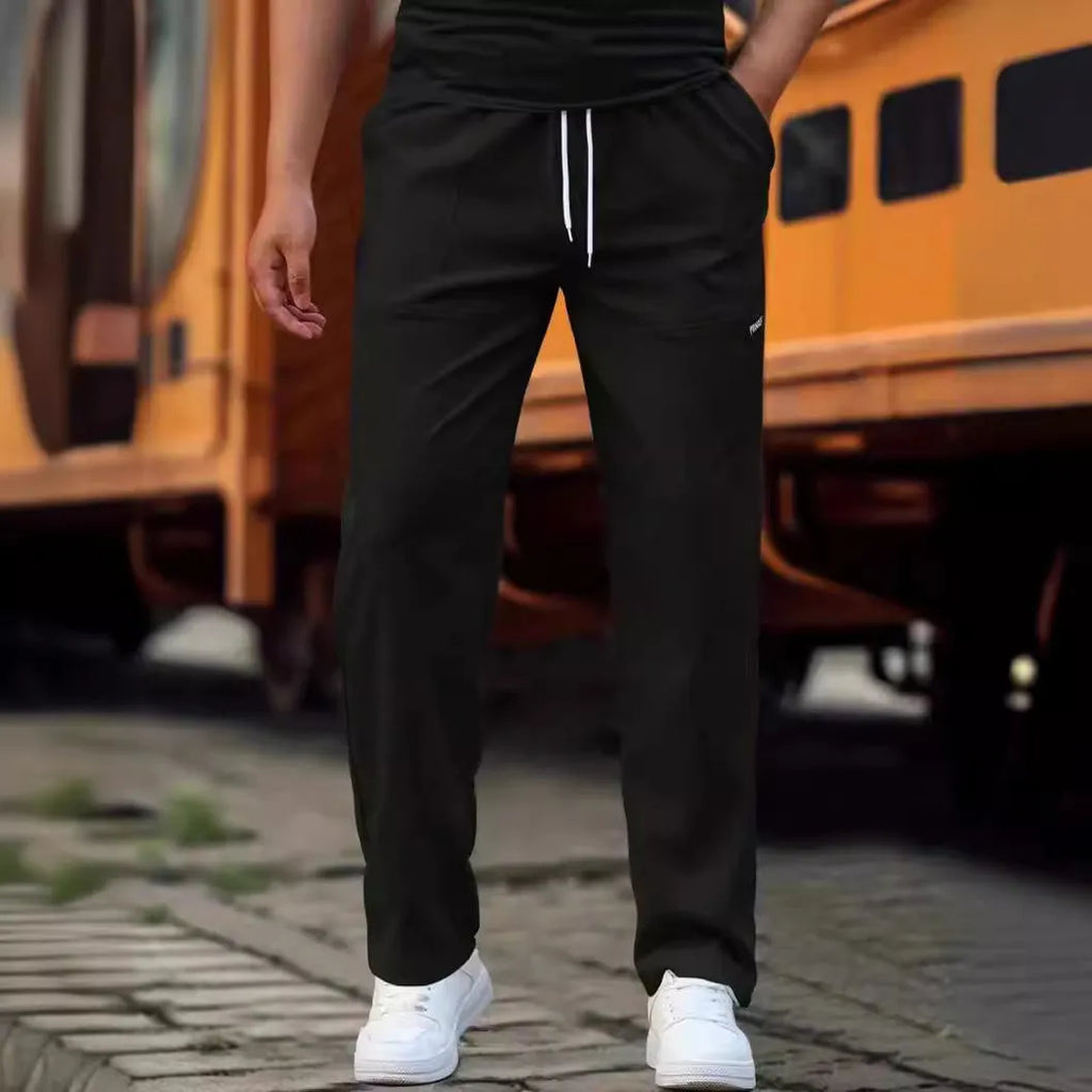 Men's straight-leg polyester trousers in light grey on a hanger