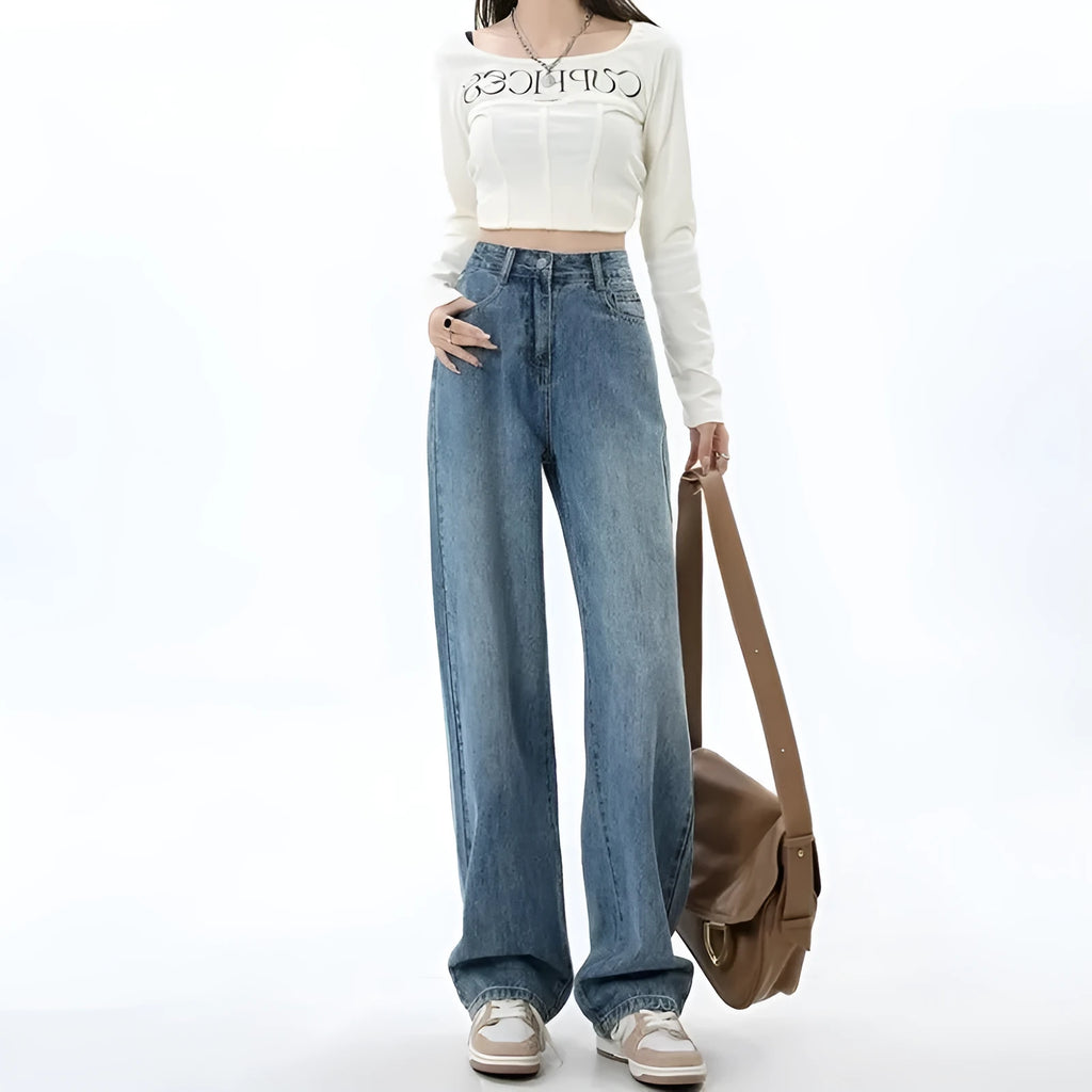 Women's retro blue high-waist wide-leg denim jeans on a hanger, showing the straight leg cut and front pockets.