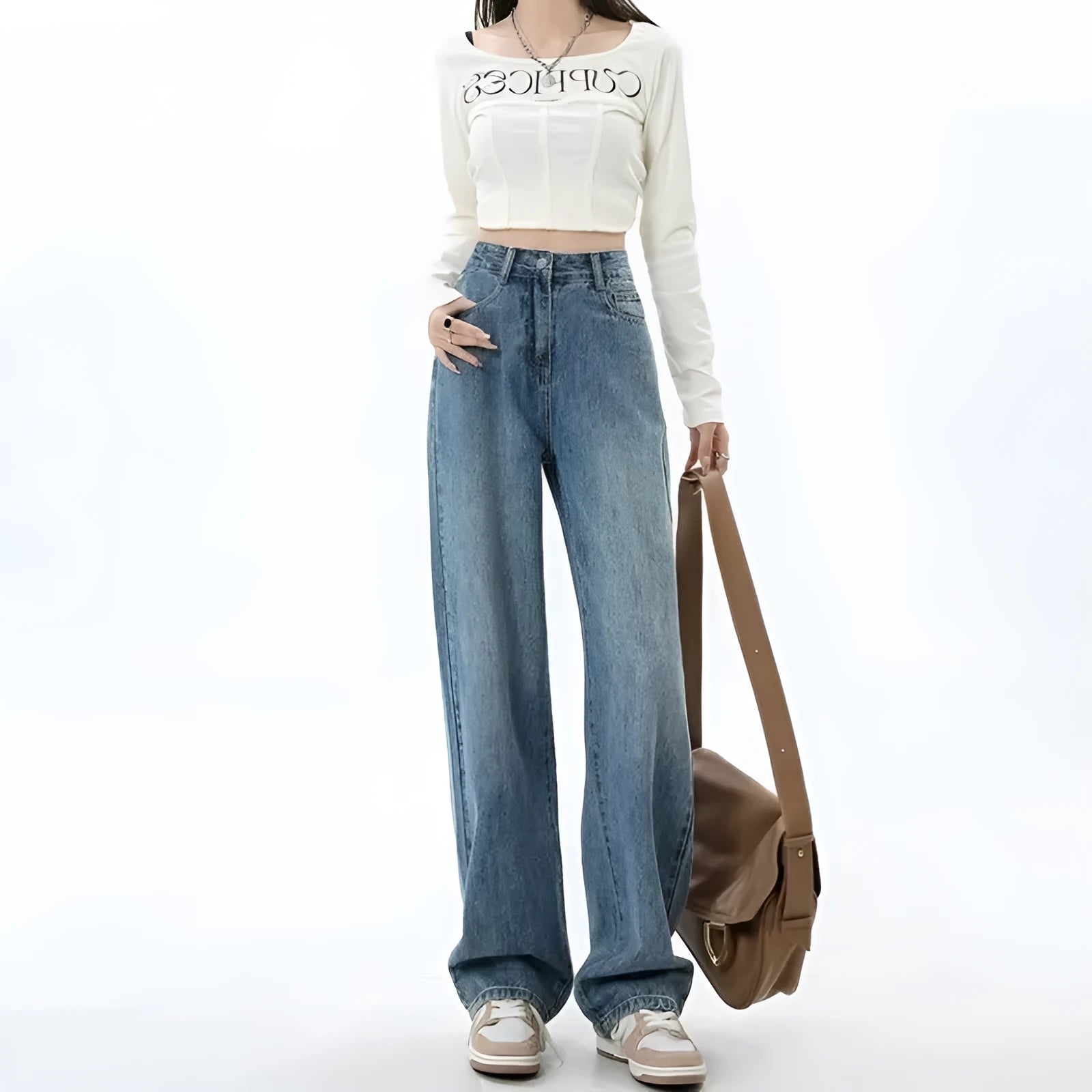 Women's retro blue high-waist wide-leg denim jeans on a hanger, showing the straight leg cut and front pockets.