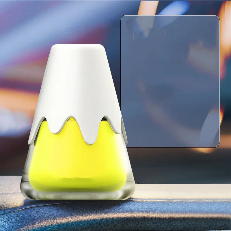 Snow mountain car aroma diffuser with glass construction measuring approximately 9.10 by 6.9 cm