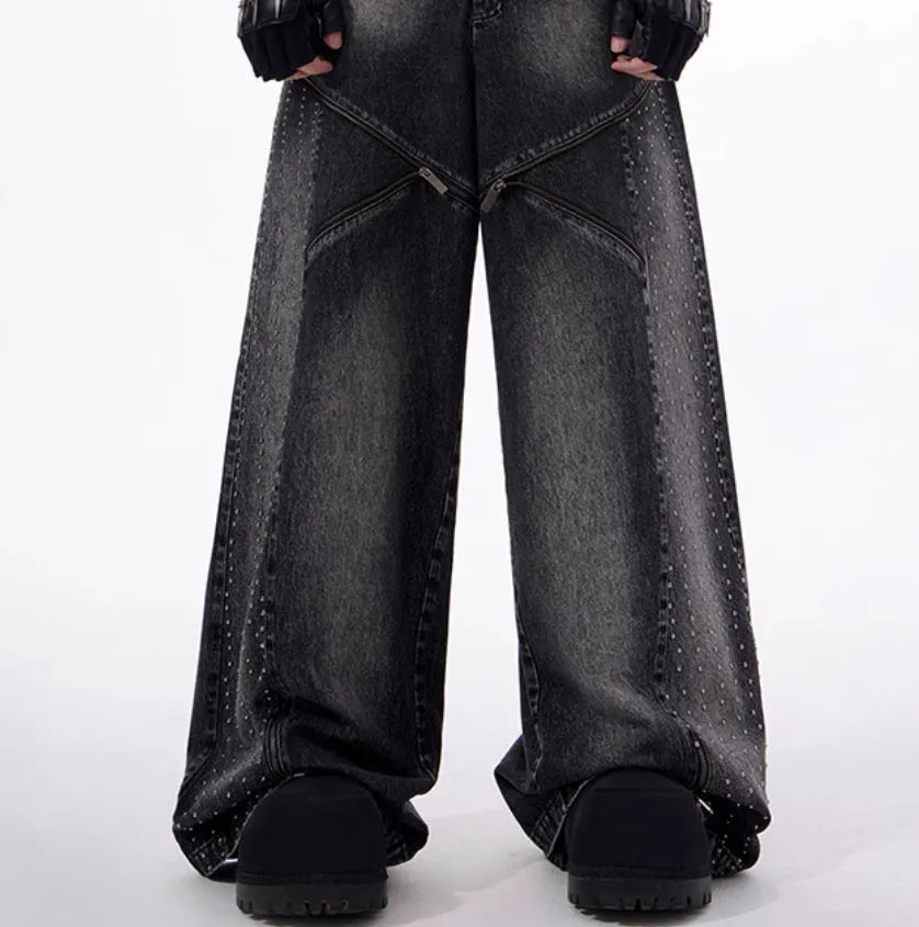 Black and grey washed wide leg cotton denim trousers and matching waistcoat set laid flat.