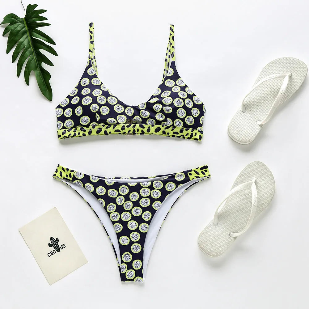 Women's black and white dot bikini set and red and white stripe bikini set laid flat.