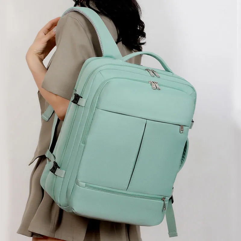Waterproof Oxford cloth backpack with multiple pockets holding a 15.6 inch laptop