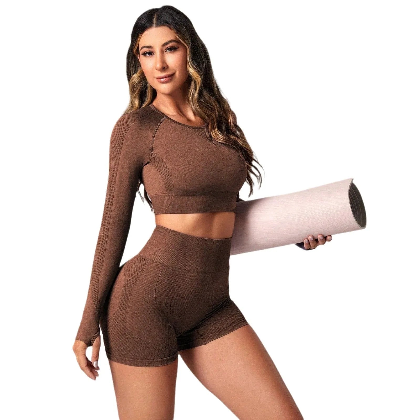 Women's black high-waist yoga pants and long-sleeve top set laid flat.