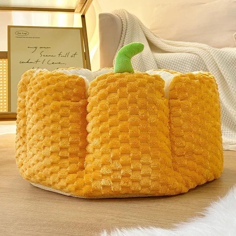 Orange pumpkin-shaped enclosed pet bed for cats or small dogs with cotton filling.