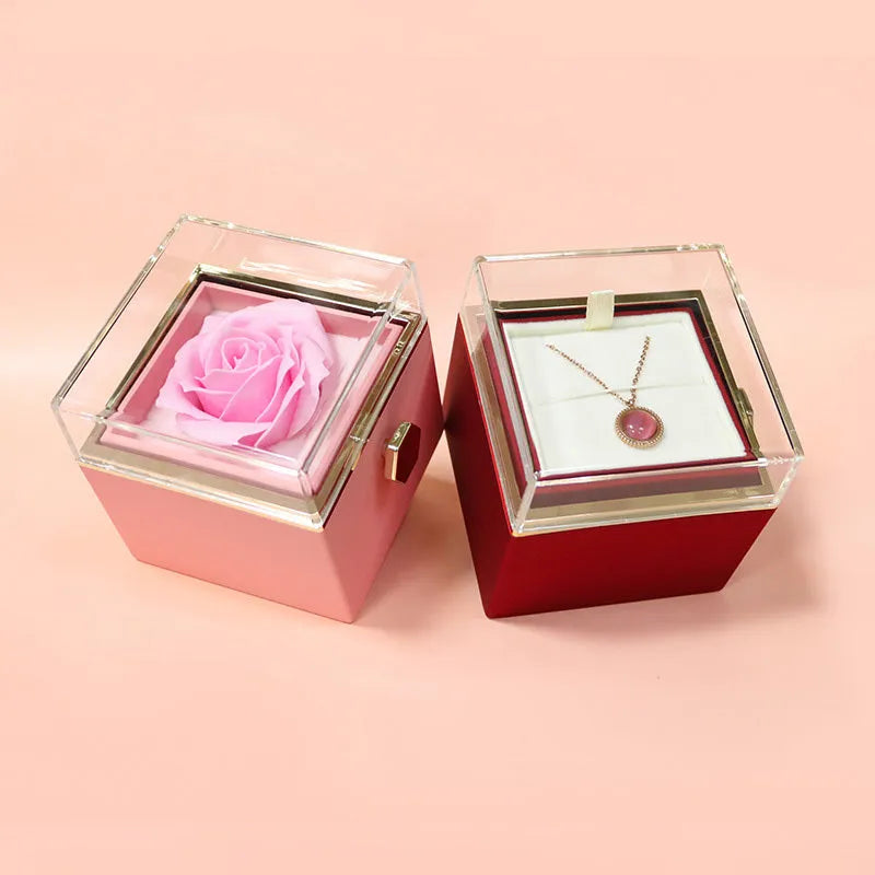 Rotating drawer jewellery gift box with preserved red rose under clear acrylic dome.