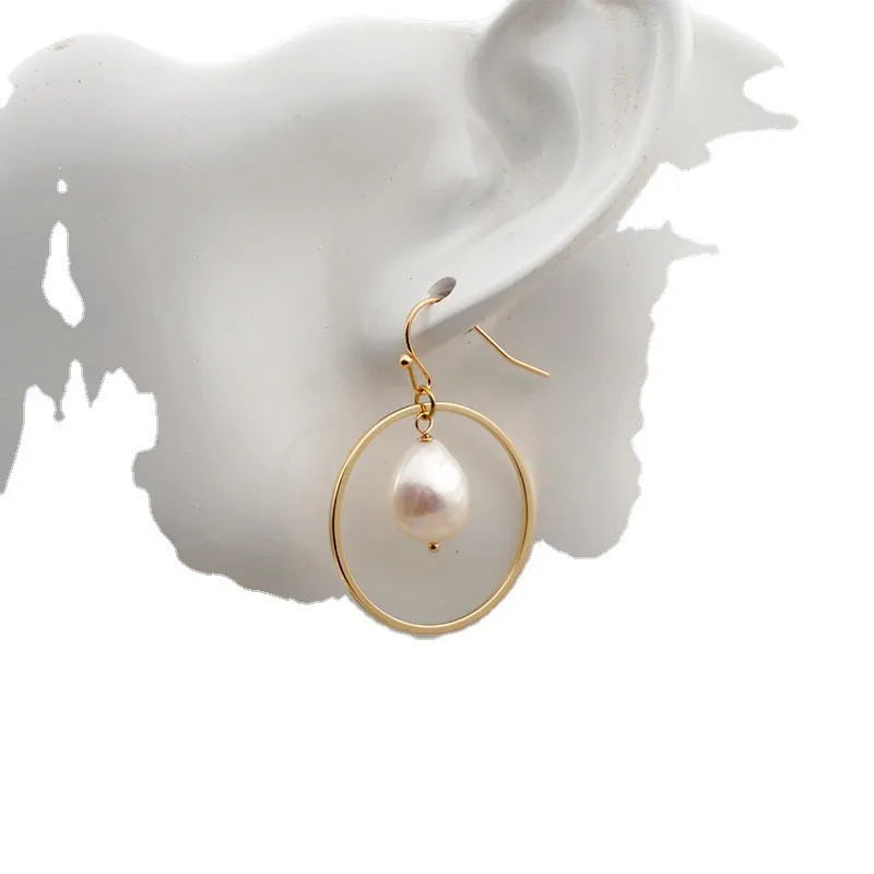 Baroque large circle shaped pearl earrings in simple geometric style for women