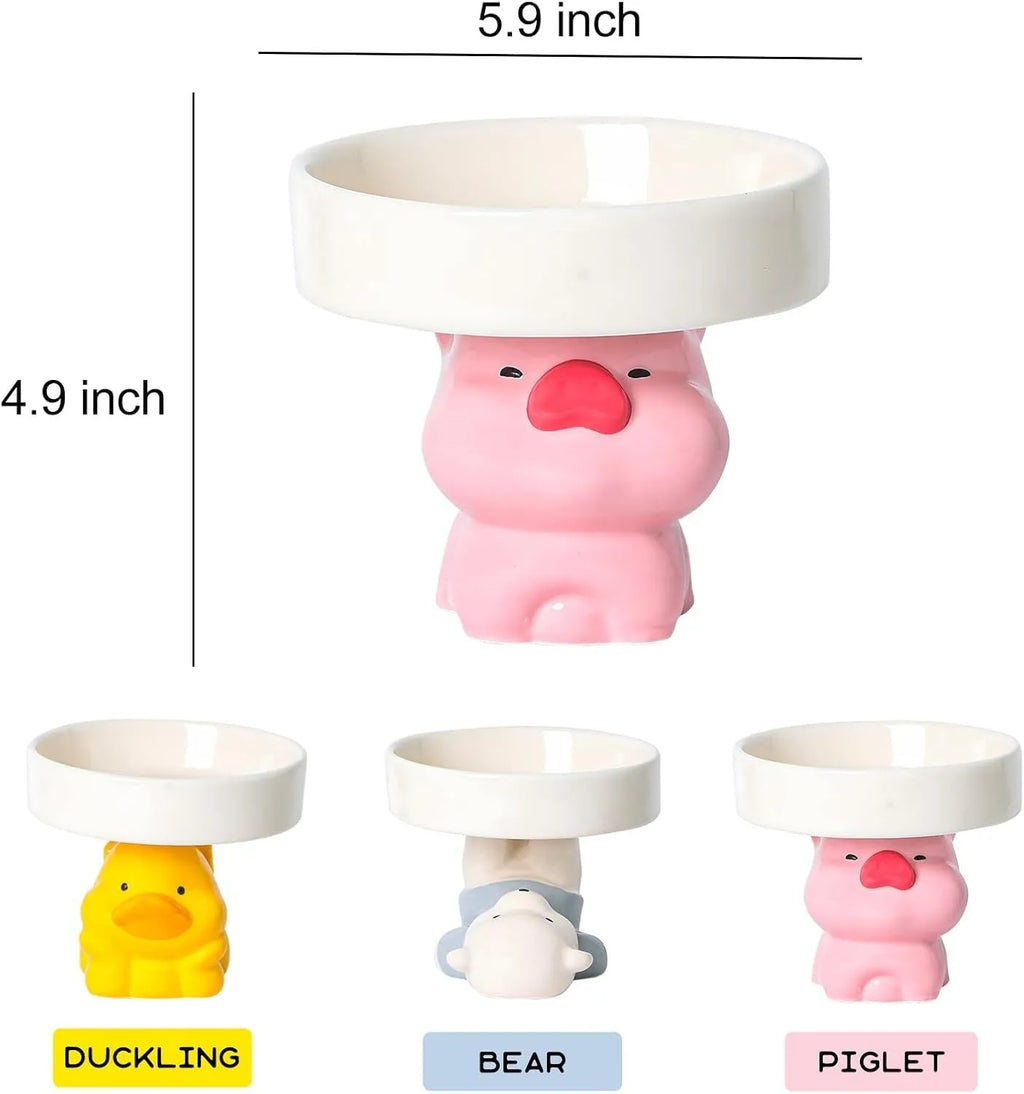 Raised ceramic cat bowl in animal theme design showing height and wide feeding surface