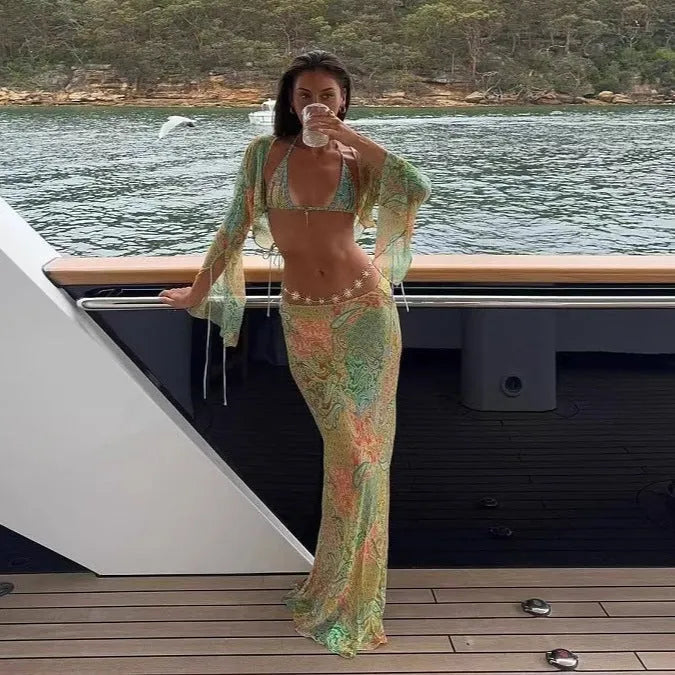 Halterneck printed lace-up split swimsuit with long bell sleeves in green, front view