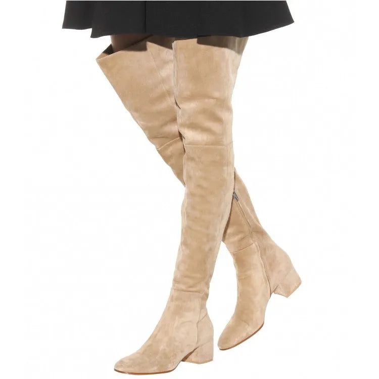 Grey suede women's over-the-knee flat boots with a pointed toe and low thick heel on a neutral background.