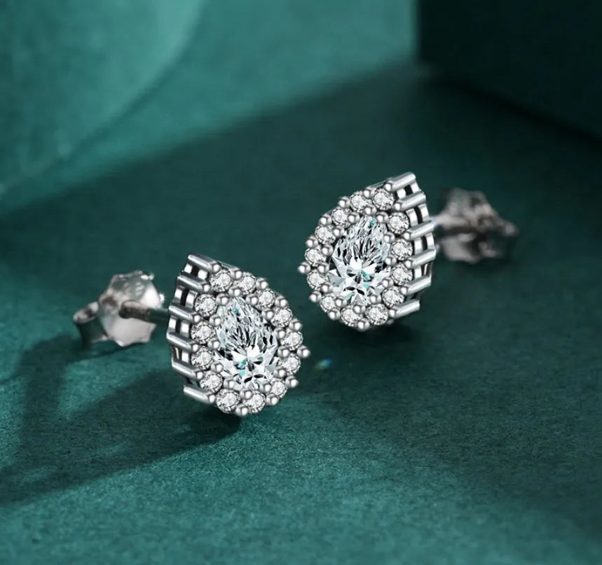 A pair of silver water drop shaped ear studs made from 925 sterling silver.