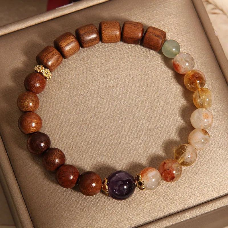 Women's bracelet with yellow tower crystal and amethyst beads, pearl and rhinestone accents