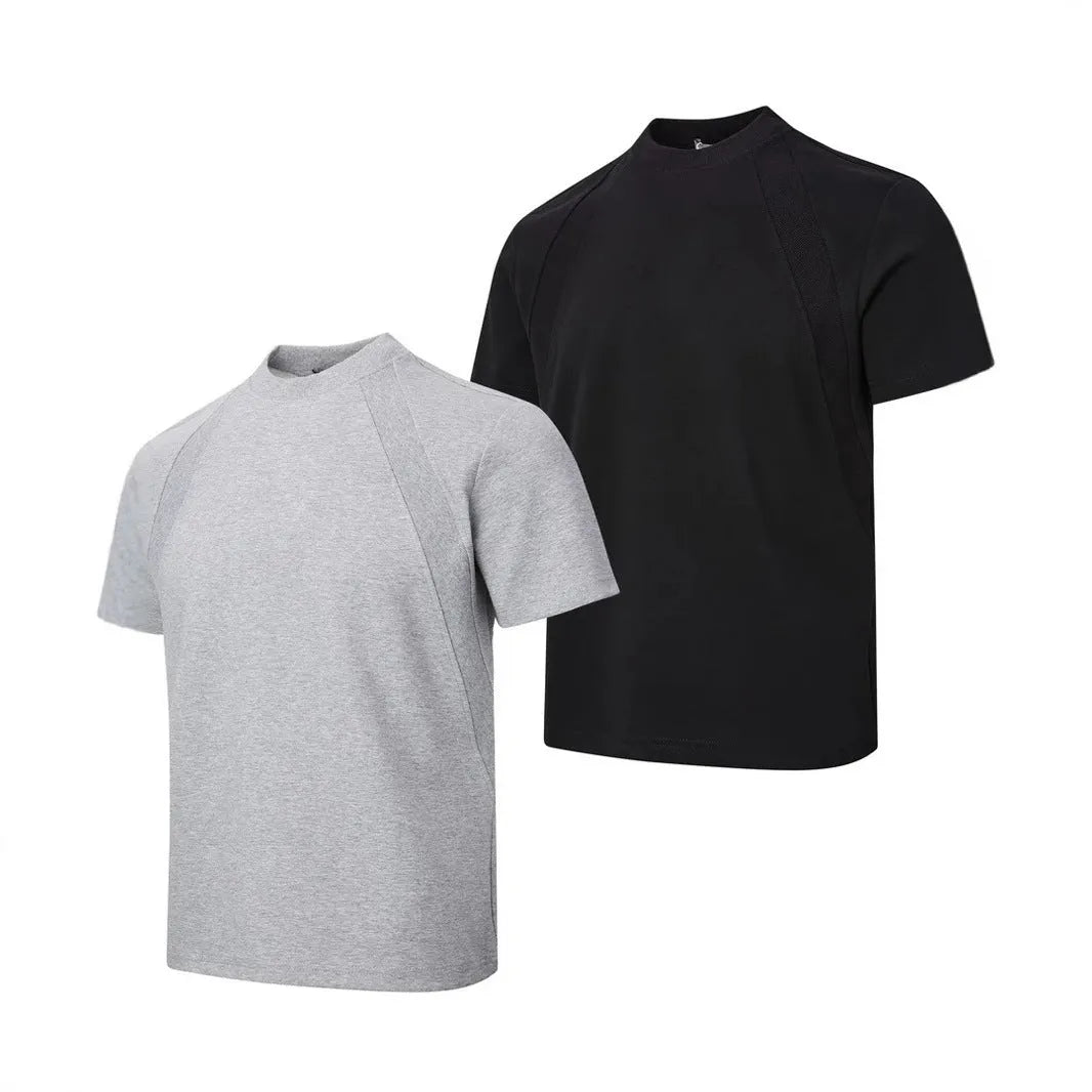 Man wearing a loose-fit grey short-sleeve top with textured air layer stitching detail.