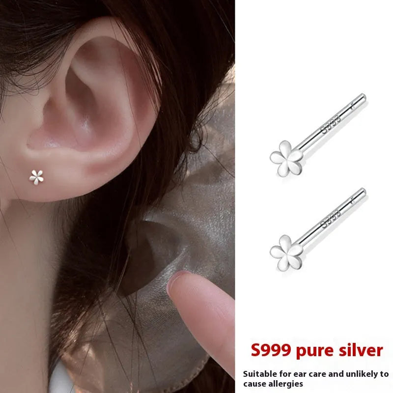 999 pure silver anti-blocking ear studs in butterfly shape on white background