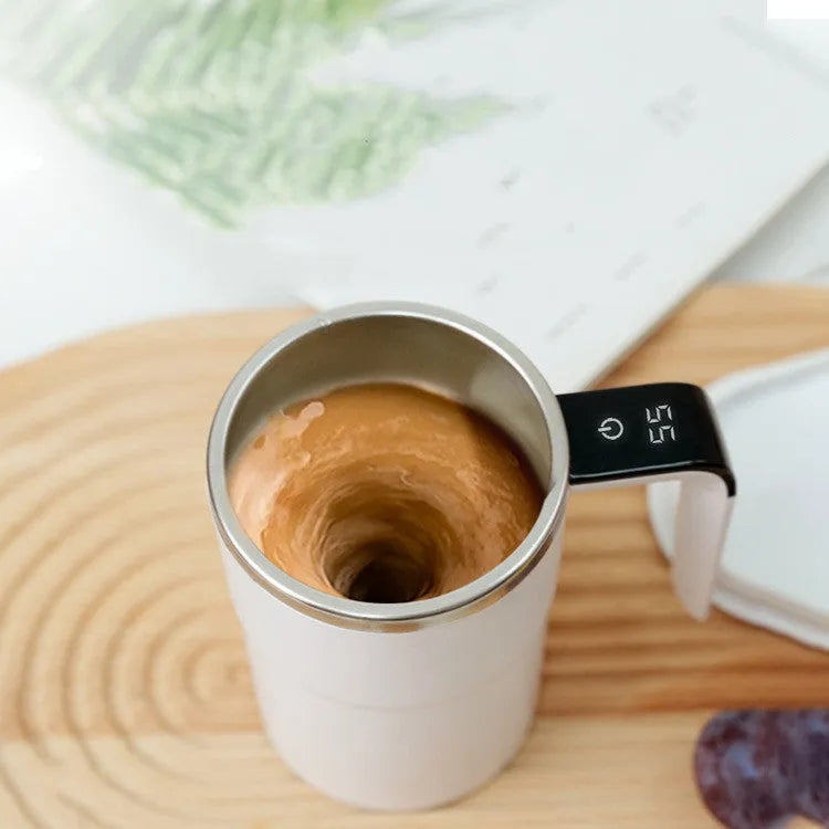 Black electric coffee mug with automatic magnetic stirring and LCD temperature display