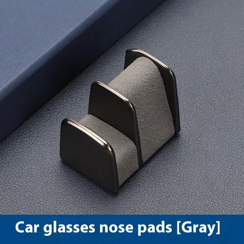 Zinc alloy and leather glasses clip for car dashboard in choice of colours.