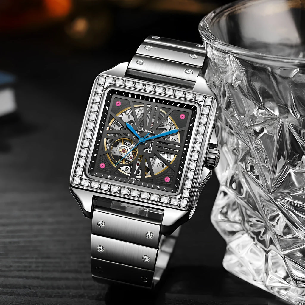 Men's square automatic watch with diamond studs on a black steel strap.
