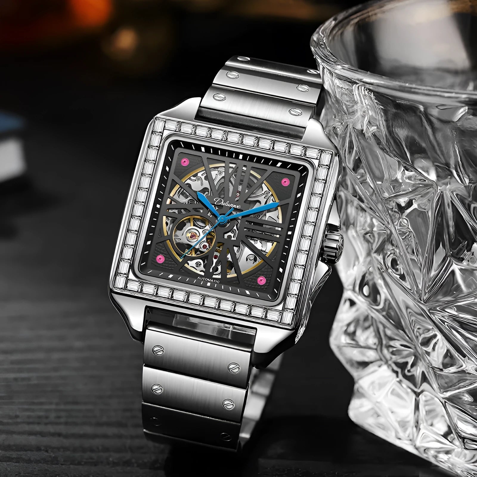 Men's square automatic watch with diamond studs on a black steel strap.