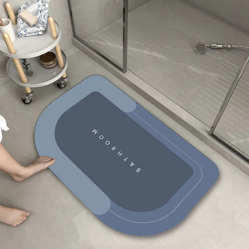Cushioned bathroom floor mat with non-slip backing in blue colour showing oval shape on bathroom tiles