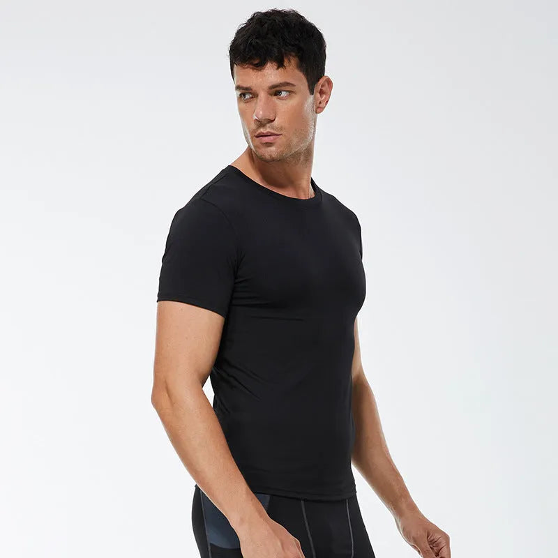 Men's solid colour short-sleeved fitness shirt in quick-drying polyester, shown in multiple colour options.