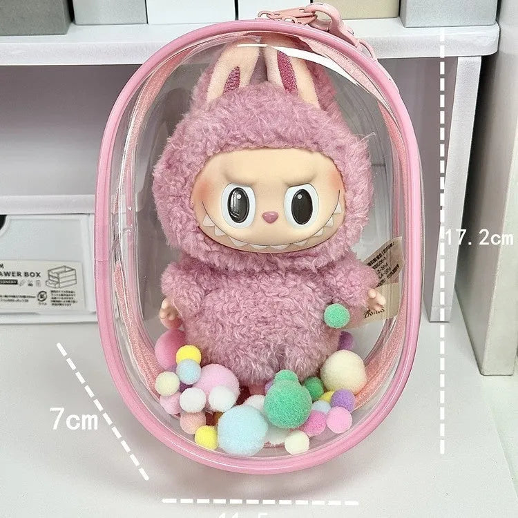 Clear PVC cube-shaped storage bag with colourful ball keychain for cotton dolls and collectibles.