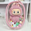 Clear PVC cube-shaped storage bag with colourful ball keychain for cotton dolls and collectibles.