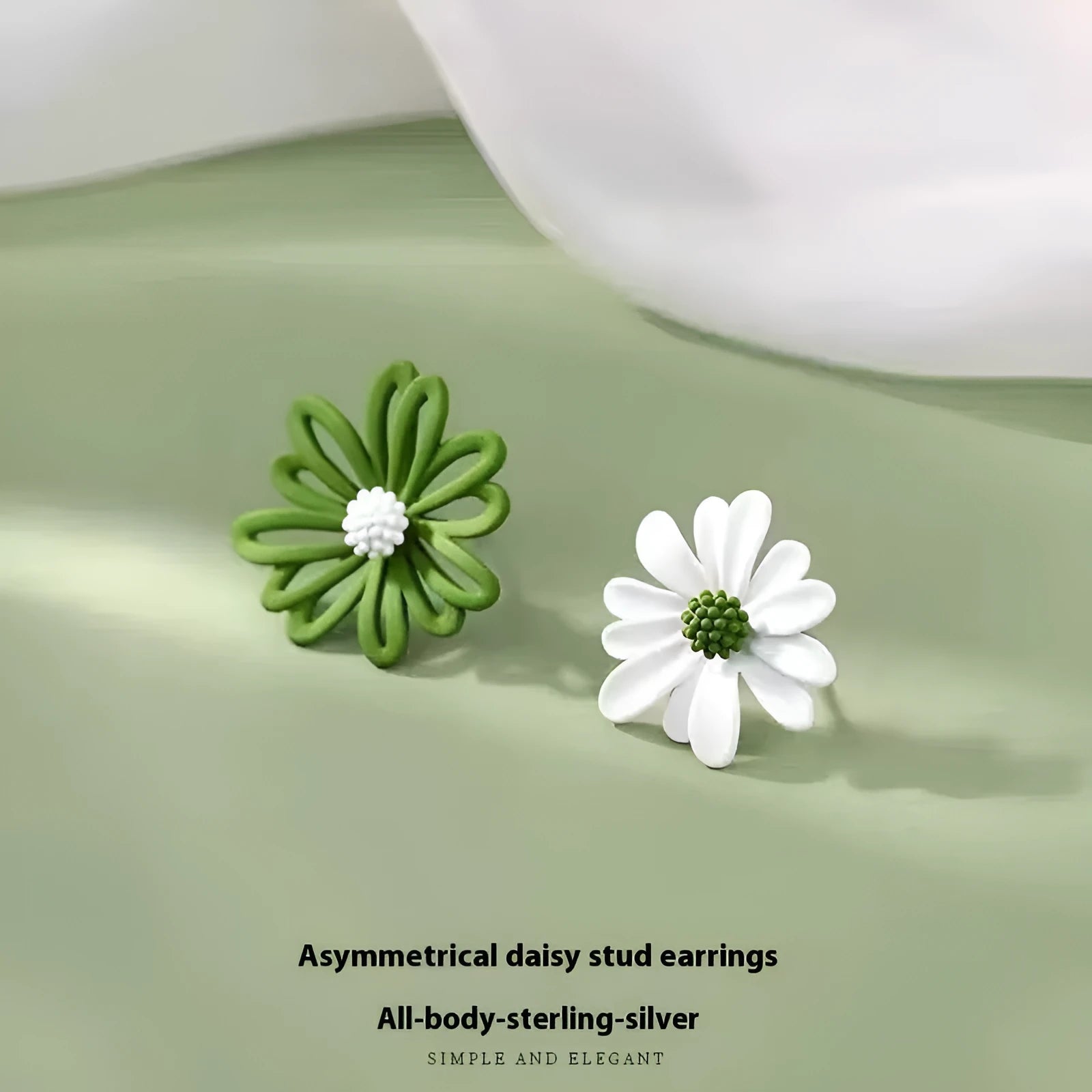 Close-up of colourful cartoon flower stud earrings in alloy on a white background.