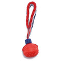 Blue natural rubber dog ball with rope toy, textured surface, shown with measurements