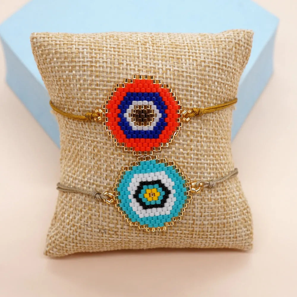 Hand-woven devil's eyes glass bead bracelet with blue eye detail in chic style for women