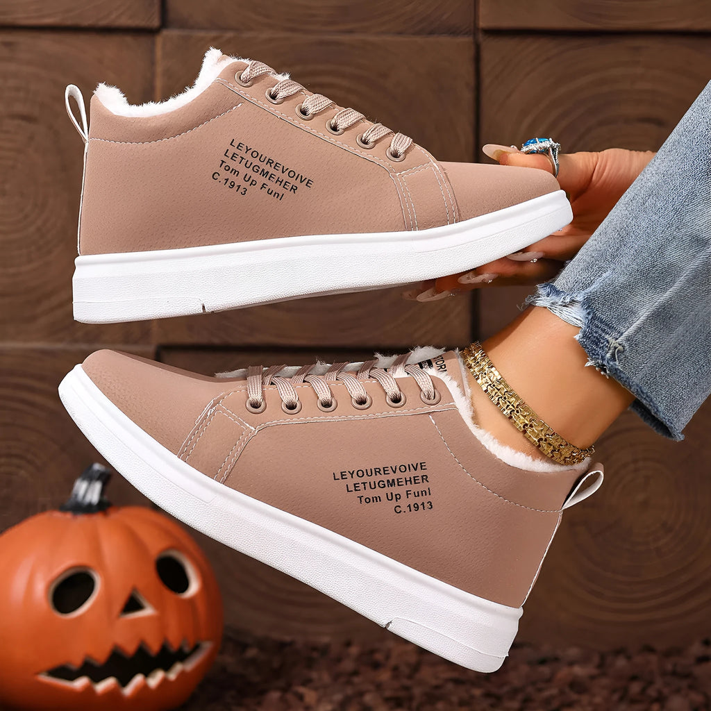 Women's flat sneakers with round toe and front lacing in black, brown, white, and pink