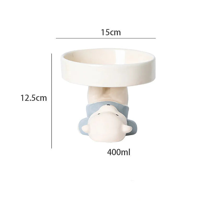 Raised ceramic cat bowl in animal theme design showing height and wide feeding surface