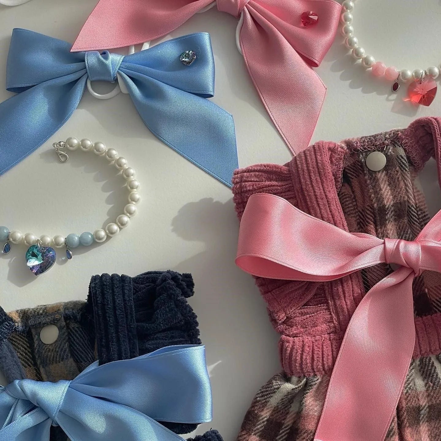 Blue adjustable dog hair band headband with a princess-style bow on a small dog.