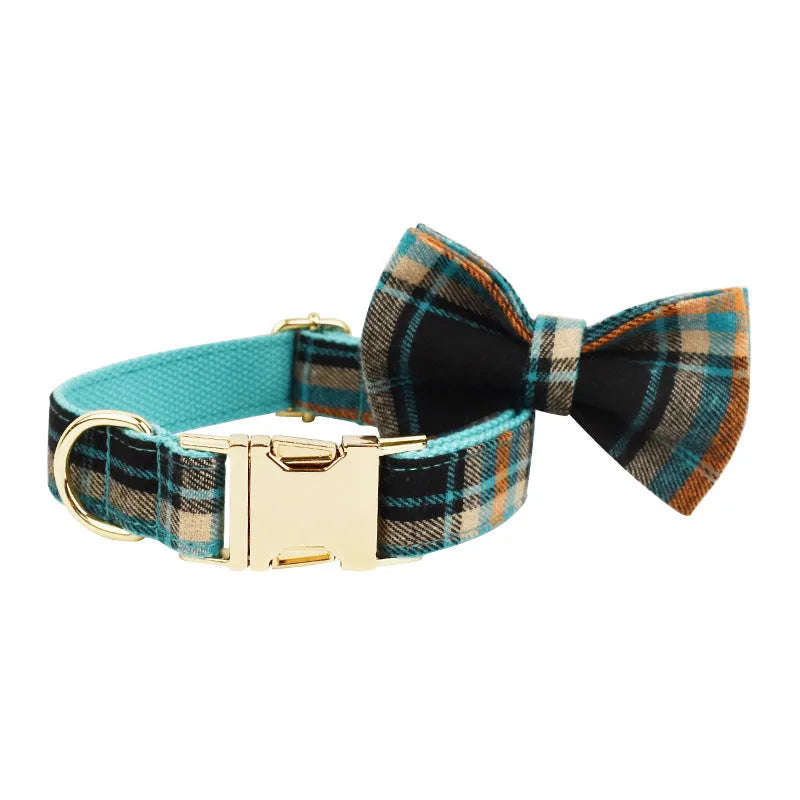 Green cloth dog collar and leash set with matching vest and bow accessory in four-piece pet package