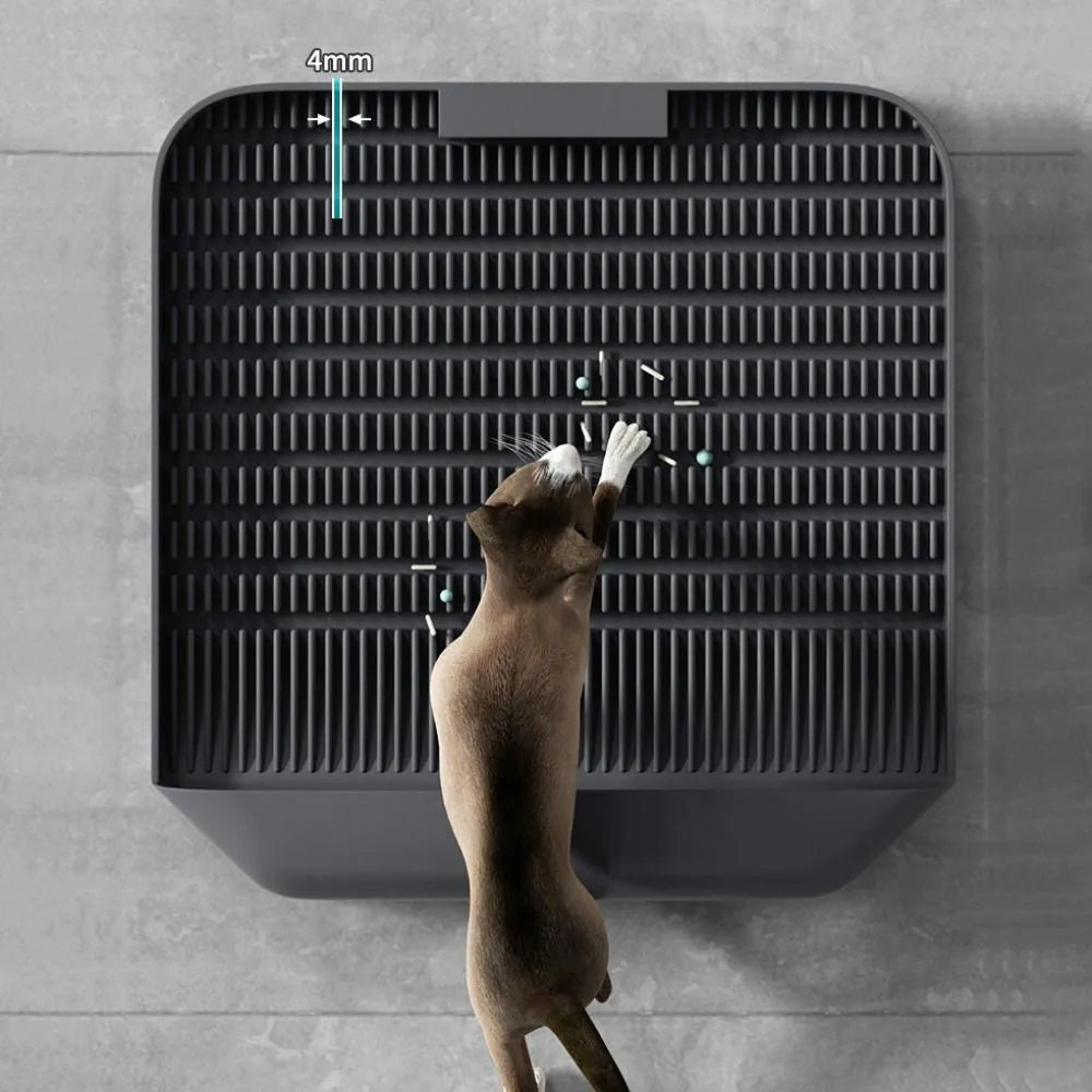 Black cat litter pedal with slanted design and textured grooves for litter containment