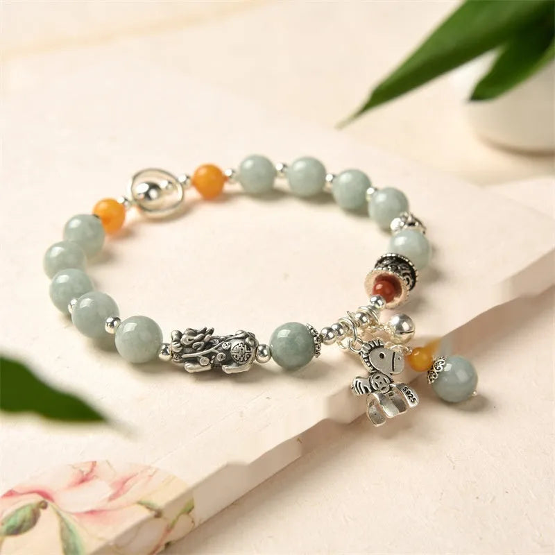 Natural jade vintage bracelet with alloy clasp on a white background.