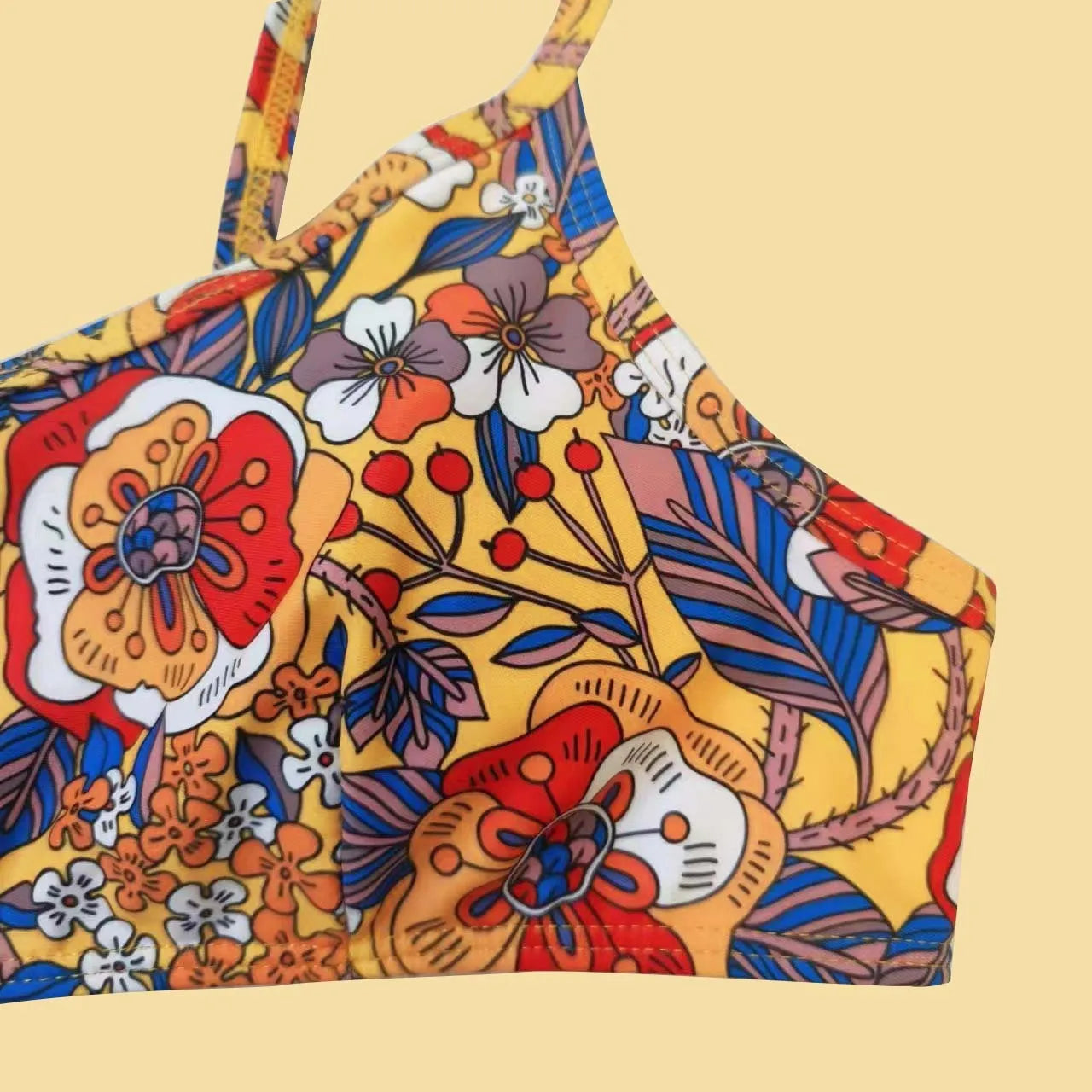 Plus size women's floral print strap bikini swimsuit set in brief style on a mannequin