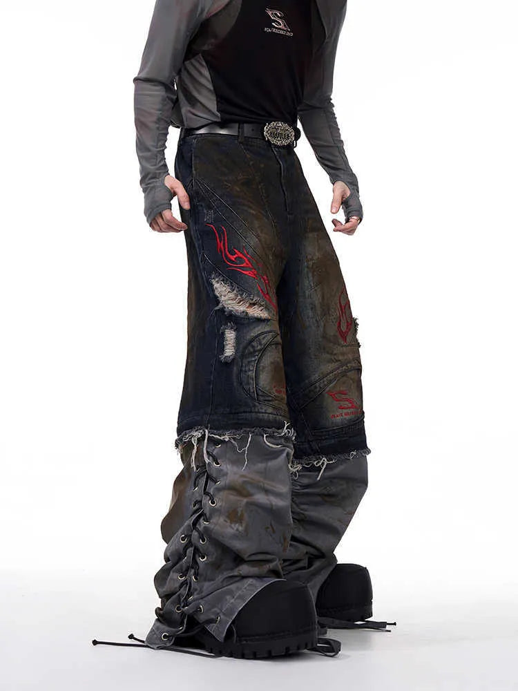 Man wearing mid-high waist wide leg denim jeans with detachable trouser legs in a picture colour.