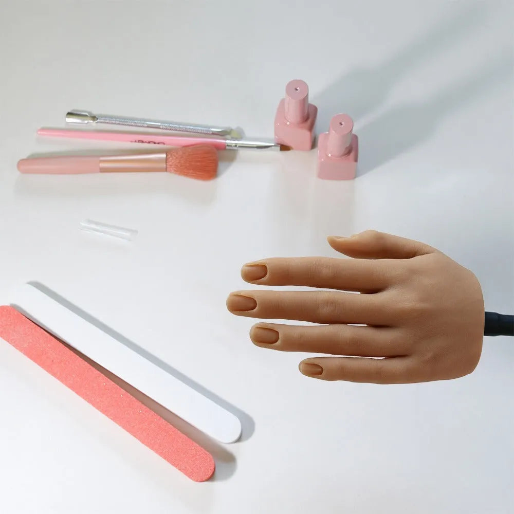 Silicone nail art practice hand model showing articulated fingers with nail beds in one of six skin tone colours