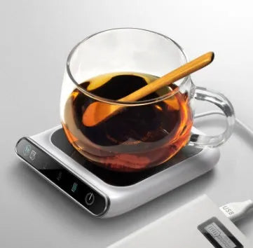 Black mini USB cup warmer with heating coaster on a desk